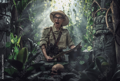 Cheerful woman exploring a tropical jungle
