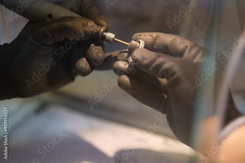 Macro shot. Craft jewelery making with professional tools. A handmade jeweler process, manufacture of jewellery.