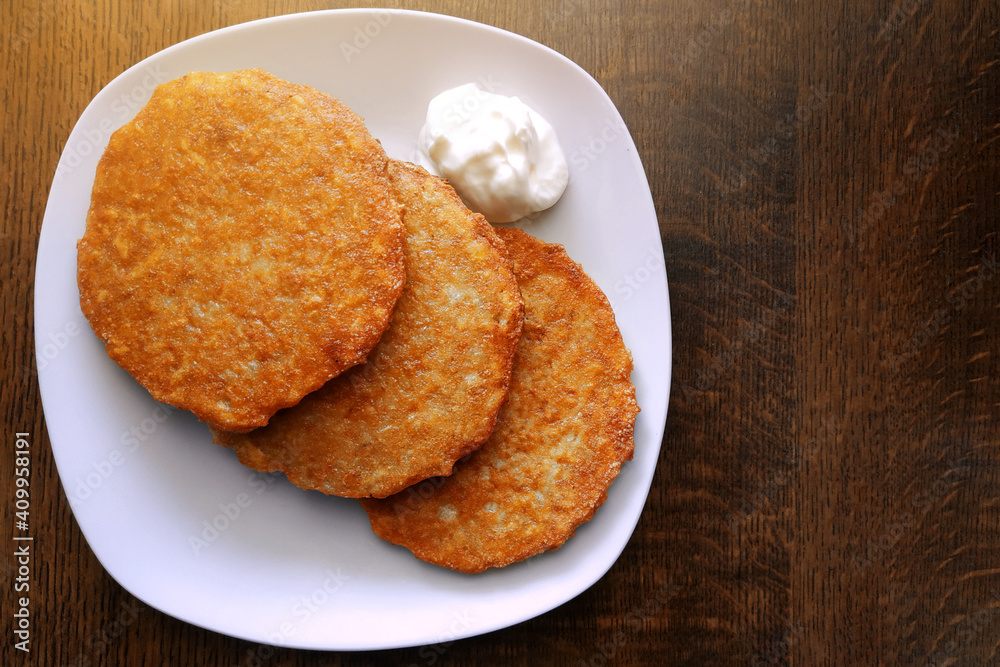 Crispy fried potato pancakes, vegetarian food, potato dish. Crispy fried potato pancakes, vegetarian food, potato dish.