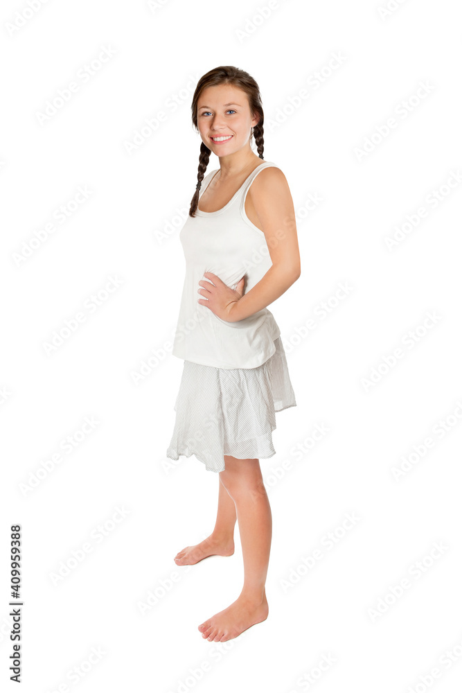 Full length portrait of a young woman with ponytails wearing a white top and a short summer skirt, isolated on white studio background Full length portrait of a young woman with ponytails wearing a white top and a short summer skirt, isolated on white studio background