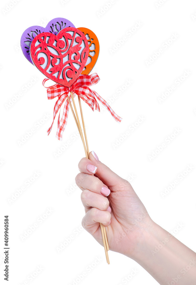 hearts on a stick decoration in hand on white background isolation hearts on a stick decoration in hand on white background isolation