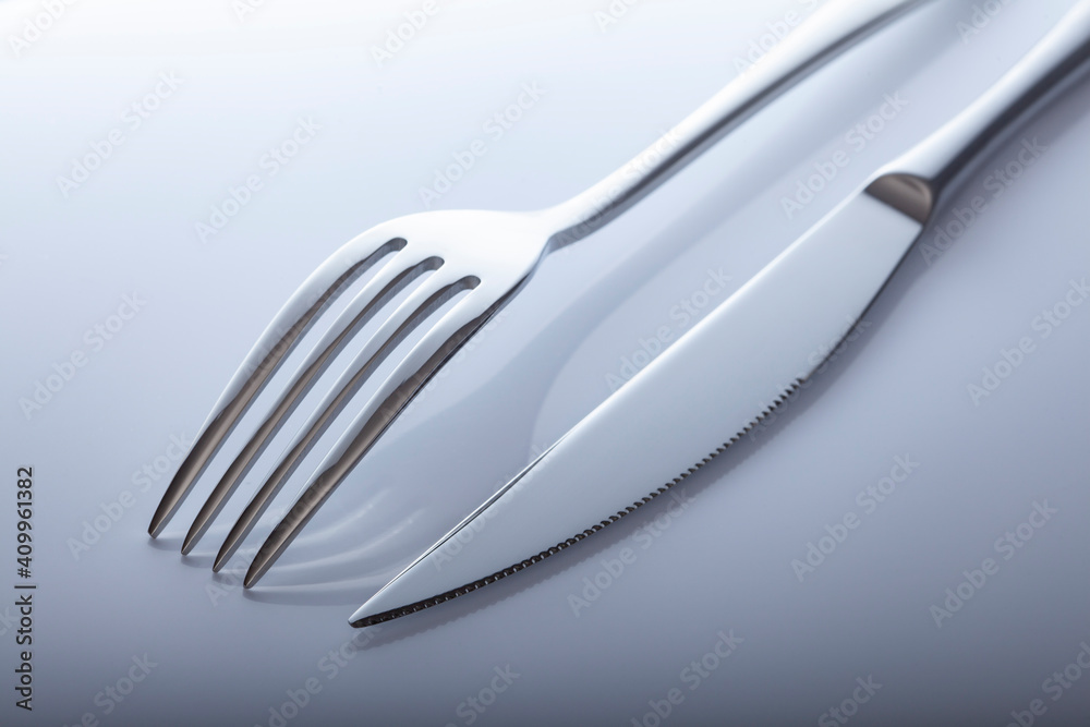 silverware fork, knife on white table silverware fork, knife on white table