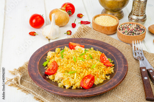Healthy food. Couscous with chicken and vegetables. Studio Photo