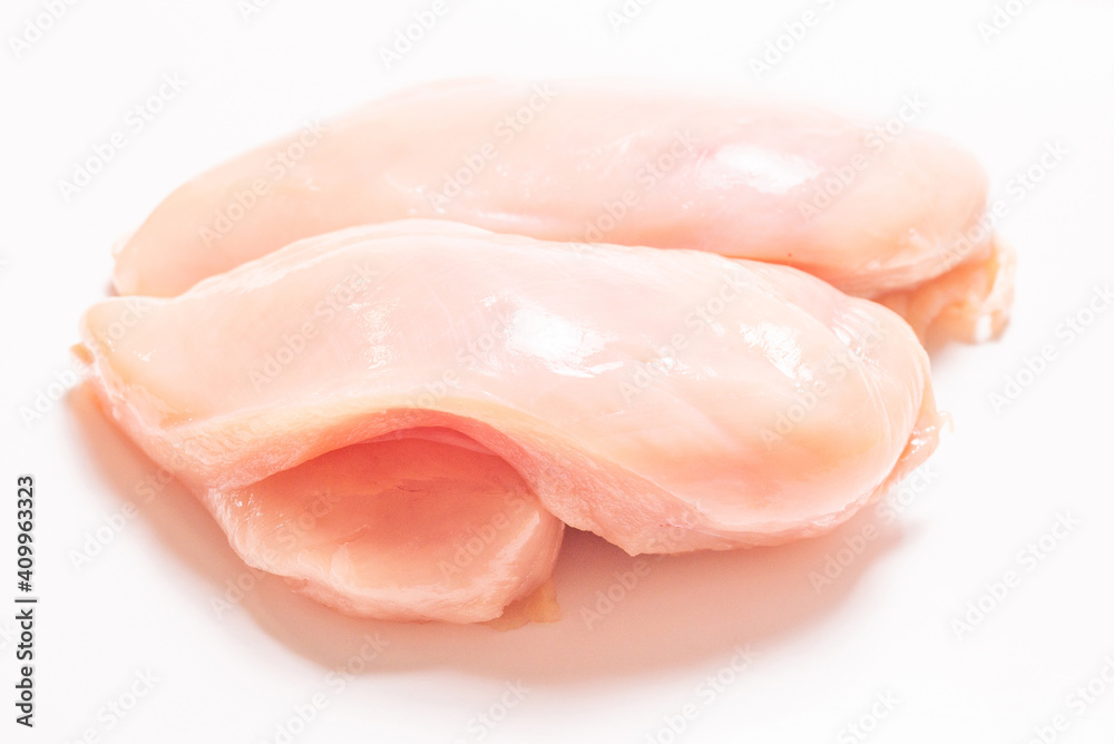 Raw chicken fillet isolated on white background. Raw chicken fillet isolated on white background.