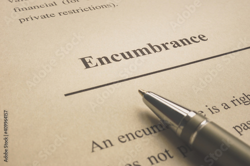 Encumbrance word on the page with pen.