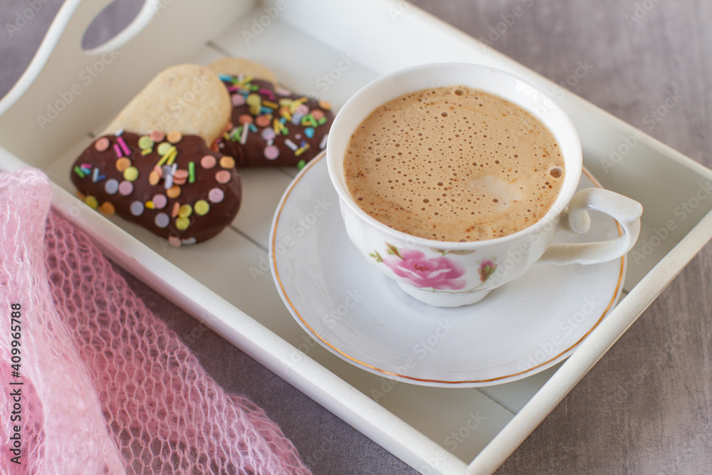 Homemade decorated heart shaped cookies for breakfast on a table Homemade decorated heart shaped cookies for breakfast on a table