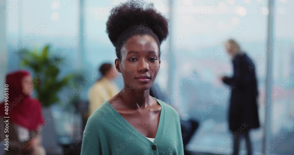 Beautiful Afro-American Nice Young Woman Smiling for Camera in the Airport. Female Tourist Portrait. Departure Lounge. People Waiting for Flight. Beautiful Afro-American Nice Young Woman Smiling for Camera in the Airport. Female Tourist Portrait. Departure Lounge. People Waiting for Flight.