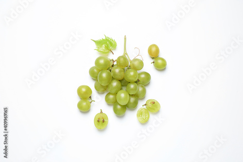 Bunch of fresh ripe green grapes with leaf on white background, top view