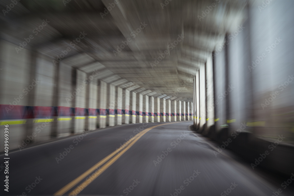 Blurred empty road with columns and concrete ceiling located in Alishan Township in Taiwan Blurred empty road with columns and concrete ceiling located in Alishan Township in Taiwan