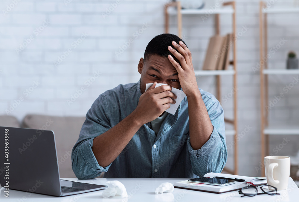 Ill Black Man Blowing Nose In Napkin Sitting In Office Ill Black Man Blowing Nose In Napkin Sitting In Office
