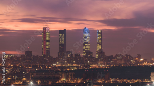 Amazing view of Cuatro Torres business area with skyscrapers under sundown sky in Madrid photo