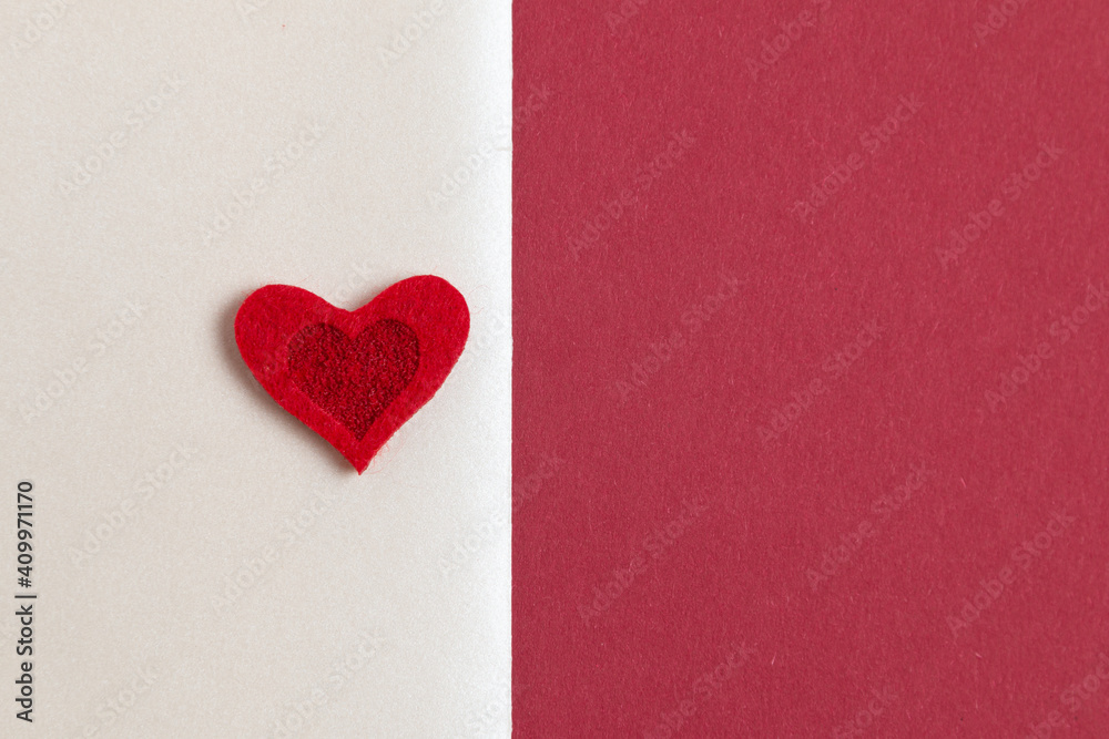 Red hearts on a background of red and white paper. Valentines Day card mock up