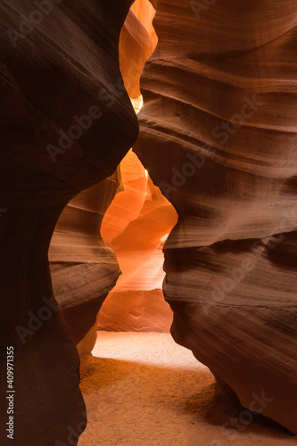 Low angle of spectacular view of Antelope Canyon with smooth brown surface located in Arizona photo