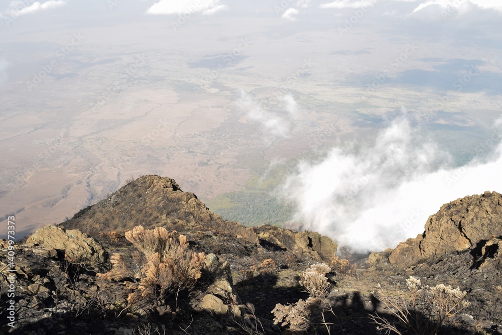Obraz premium Scenic rock formations above the clouds at Mount Meru, Tanzania