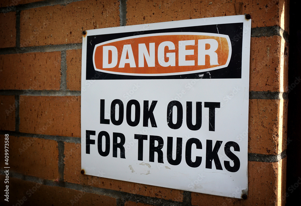 Look out for trucks warning danger sign Look out for trucks warning danger sign