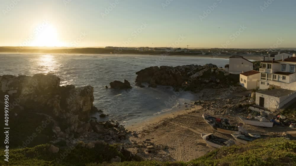 Aerial shot of Casais do Baleal, Portugal, Europe at sunrise. Morning view with ocean waves rolling on beach. Rocky coast of atlantic ocean. Small houses at ocean shoreline. 4k footage in time lapse Aerial shot of Casais do Baleal, Portugal, Europe at sunrise. Morning view with ocean waves rolling on beach. Rocky coast of atlantic ocean. Small houses at ocean shoreline. 4k footage in time lapse