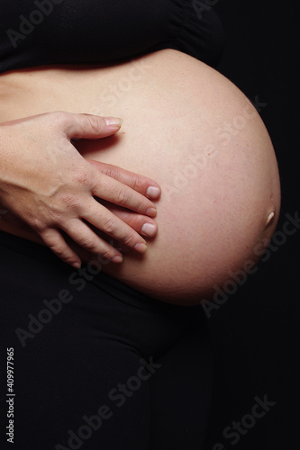 woman holding her belly