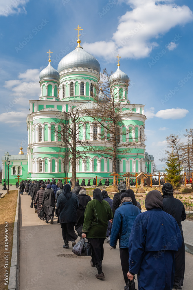 Diveevo in spring. Holy Trinity Seraphim-Diveyevsky Monastery. Clergy and pilgrims during a religious procession on the territory of the monastery