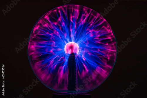 Magenta-blue glowing plasma ball on black background