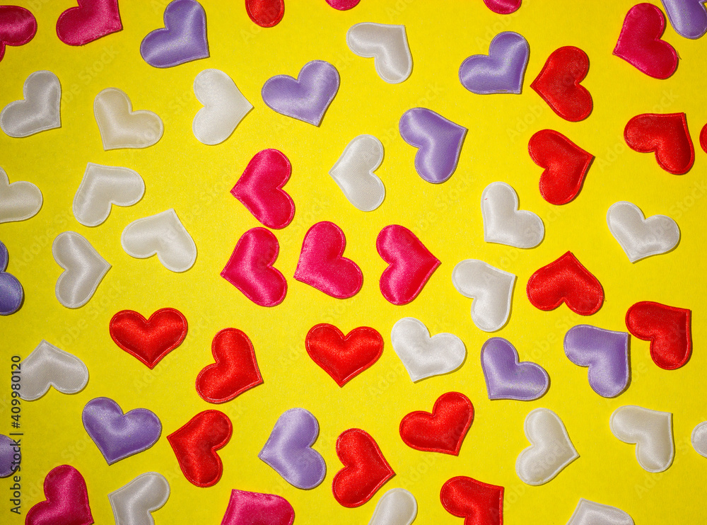 valentine's day, hearts of different colors on a yellow background valentine's day, hearts of different colors on a yellow background