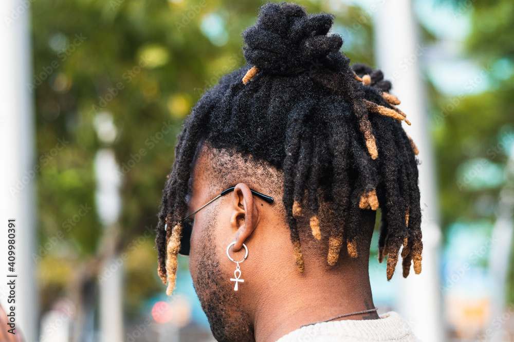 Back View Of African American Man With Dreadlocks In Bun Wearing Ankh Earring With Sunglasses On Blurred Street Background Stock Photo Adobe Stock Back View Of African American Man With Dreadlocks In Bun Wearing Ankh Earring With Sunglasses On Blurred Street Background Stock Photo Adobe Stock