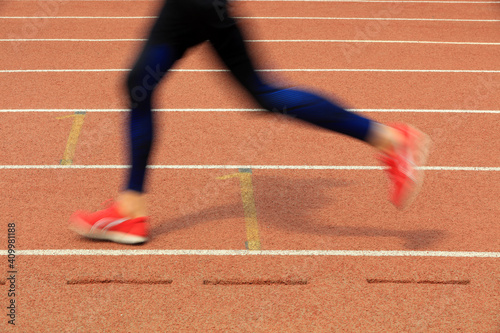 Long distance runners are running on the track