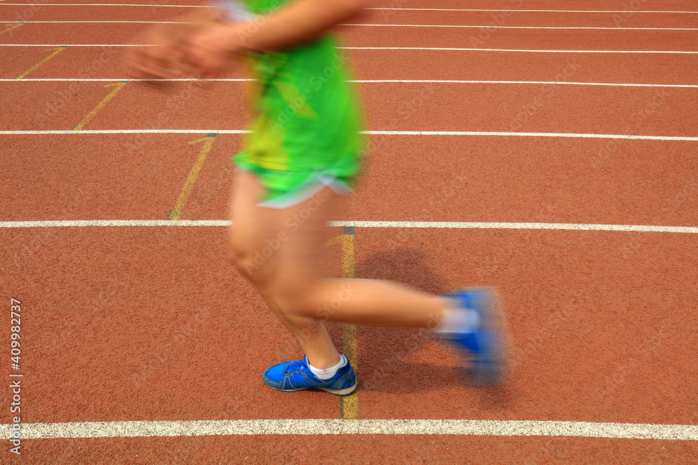 Long distance runners are running on the track