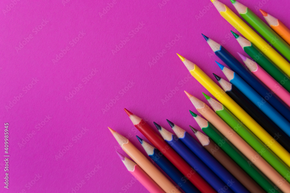 Much colour pencils on the pink background. Much colour pencils on the pink background.