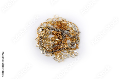 gold and silver chains in a pile