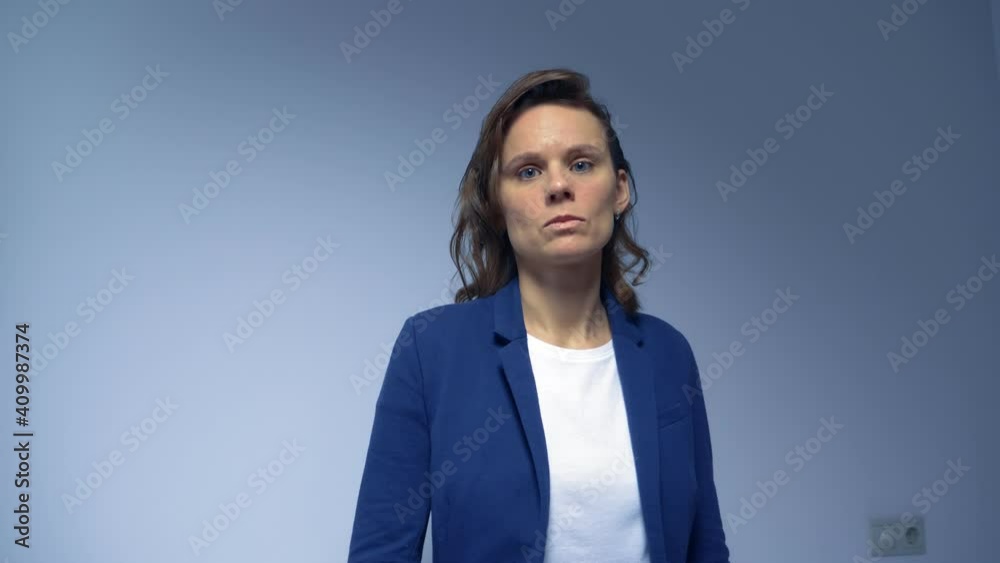 portrait. woman in suit on gray background looking at camera. copy space. portrait. woman in suit on gray background looking at camera. copy space.