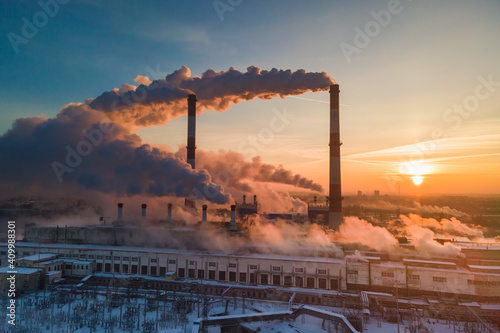 Industrial factory pollution, smokestack exhaust gases. Industry zone, thick smoke. Climate change and global warming photo