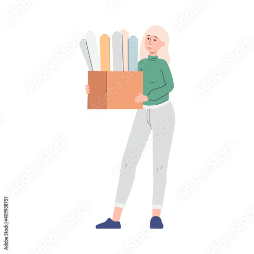 Woman printing shop employee holds holds box with designer paper samples