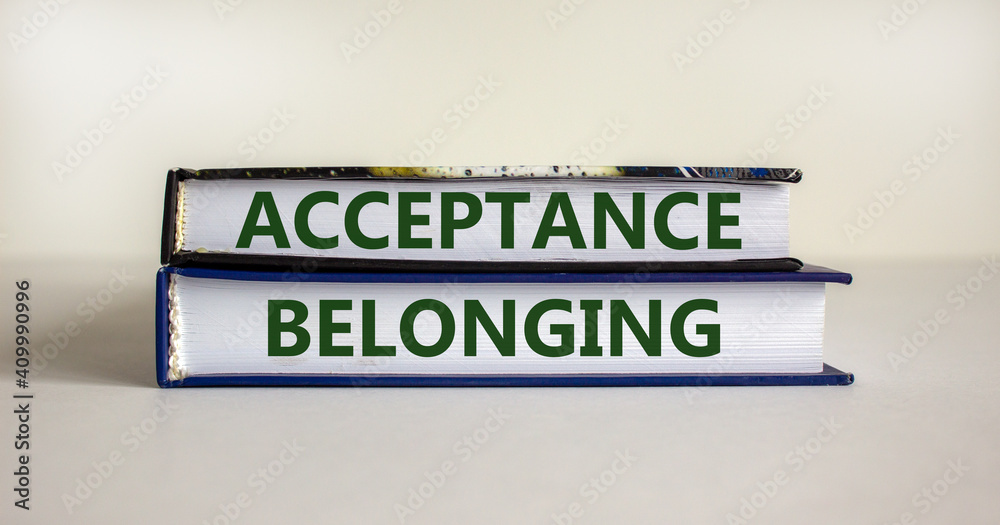 Acceptance and belonging symbol. Books with words 'acceptance and belonging' on beautiful white background. Business, acceptance and belonging concept. Copy space.
