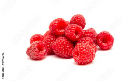 Appetizing red raspberry berries close up