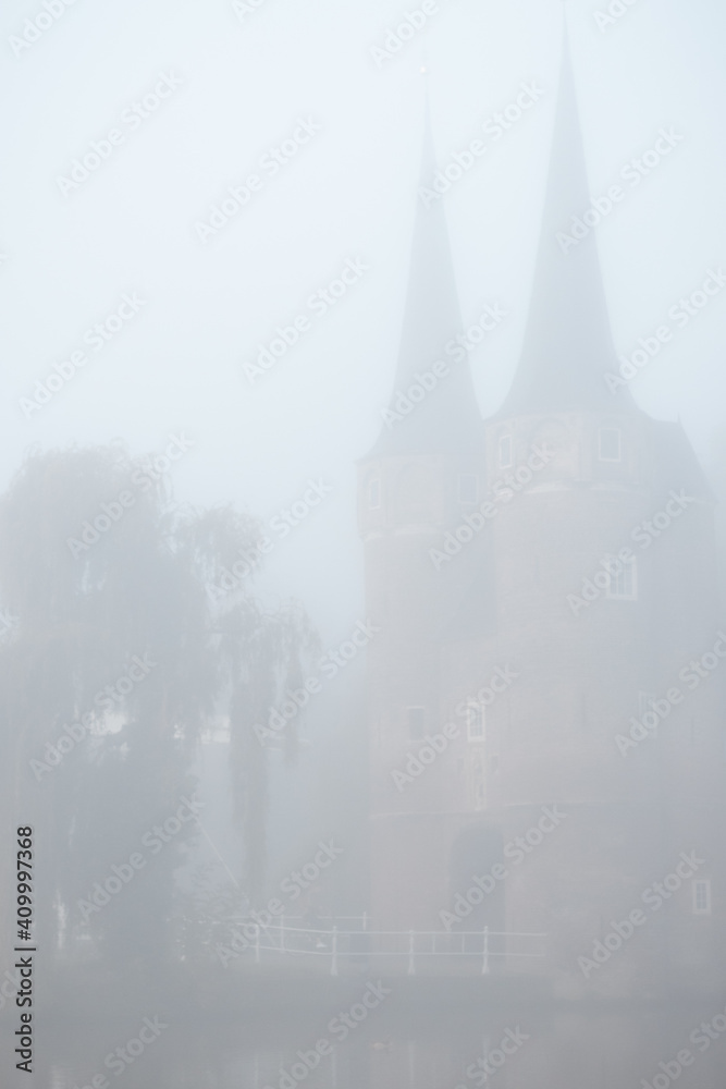 Old city center of Delft in a foggy and wet cold day