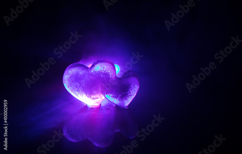 Valentines background. Valentine's Day heart on a dark wooden table. Toned, copy space