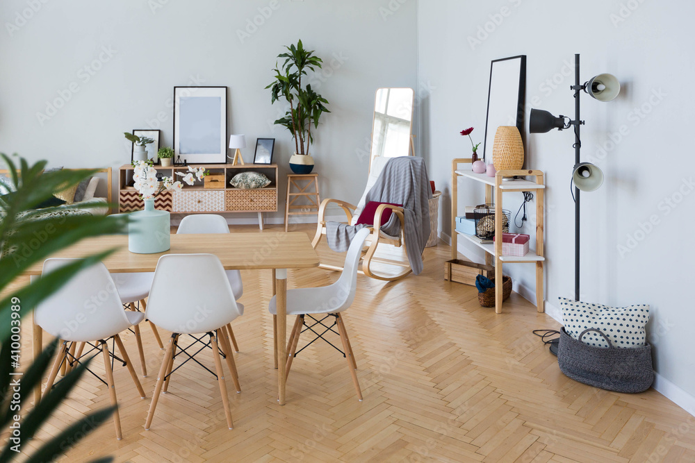 The interior design of the studio apartment in Scandinavian style. A spacious huge room in light colors. stylish expensive luxury furniture. The interior design of the studio apartment in Scandinavian style. A spacious huge room in light colors. stylish expensive luxury furniture.