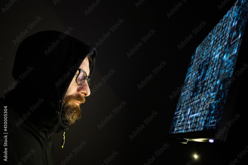 hacker coding at night cybersecurity concept