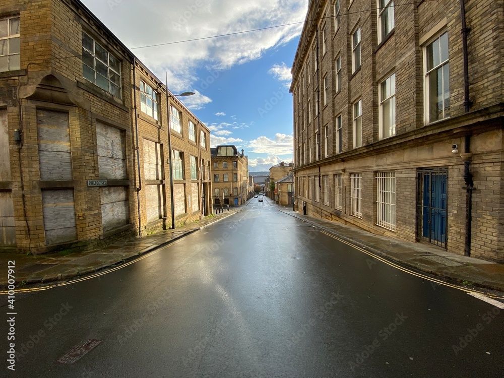 Built in the Victorian era, a view down, Chapel Street, on a wet day in, Little Germany, Yorkshire, Bradford, UK