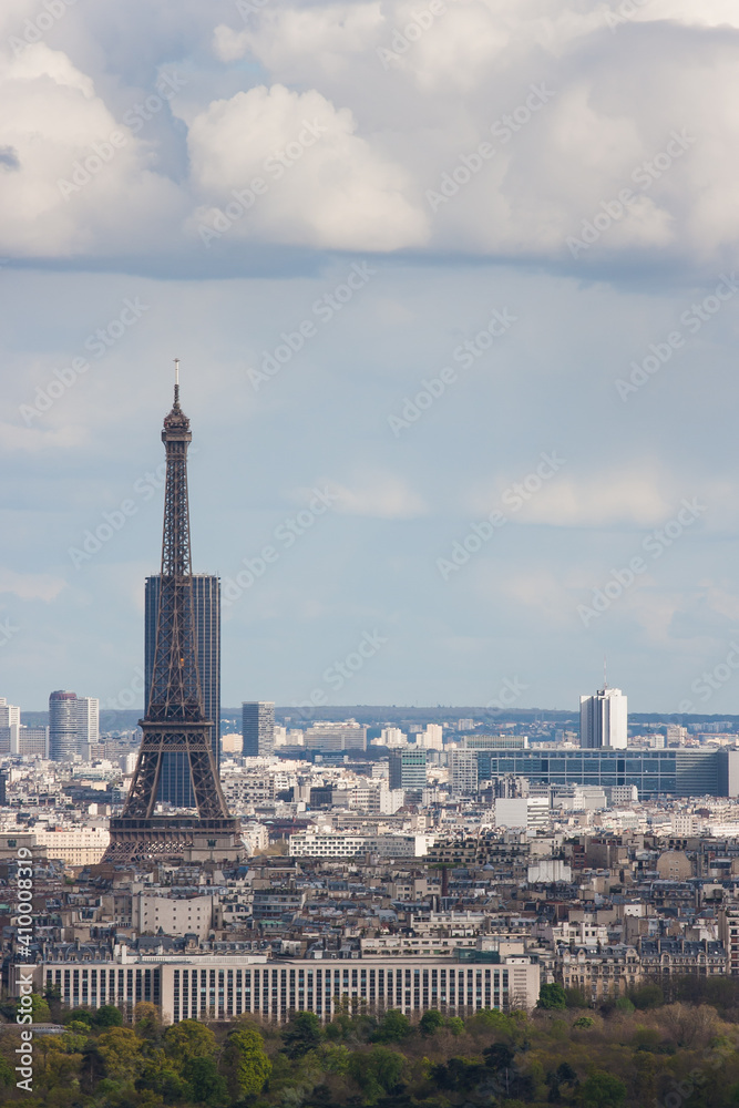 The Eiffel Tower is visible against the backdrop of the Montparnasse tower. Paris. France