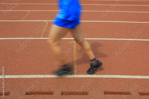 Long distance runners are running on the track