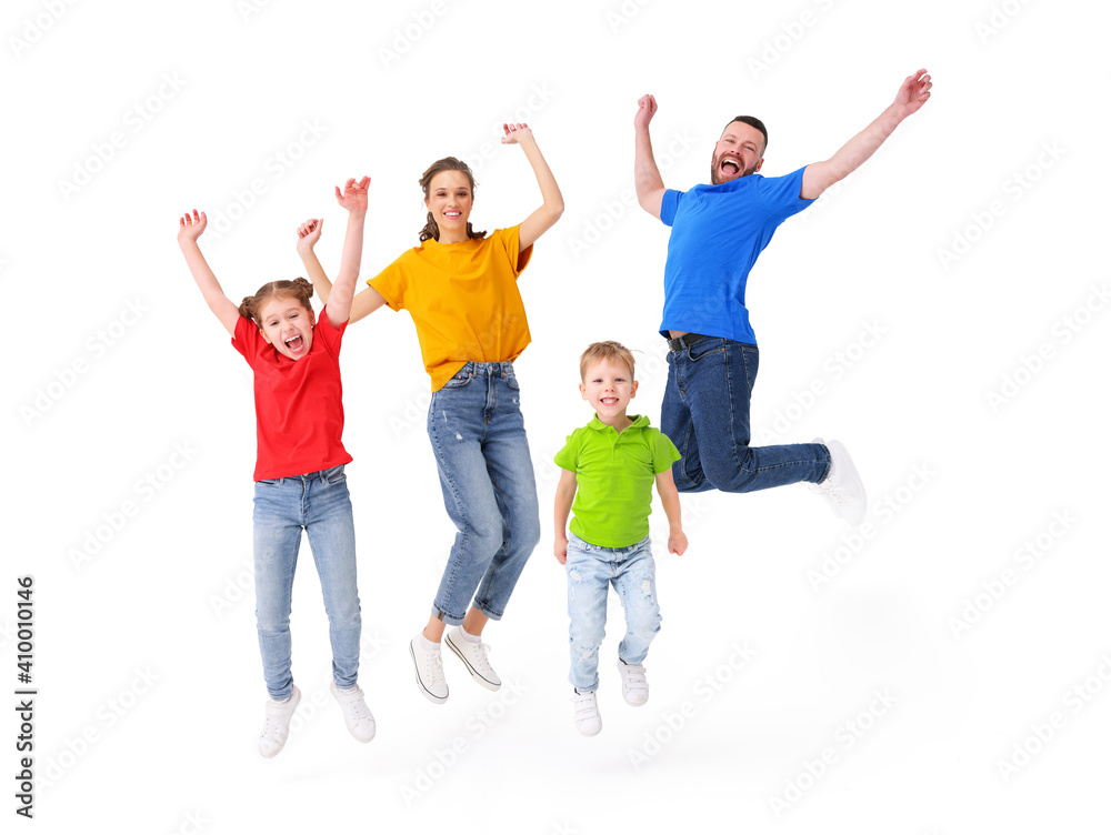 Delighted family jumping together in studio Delighted family jumping together in studio