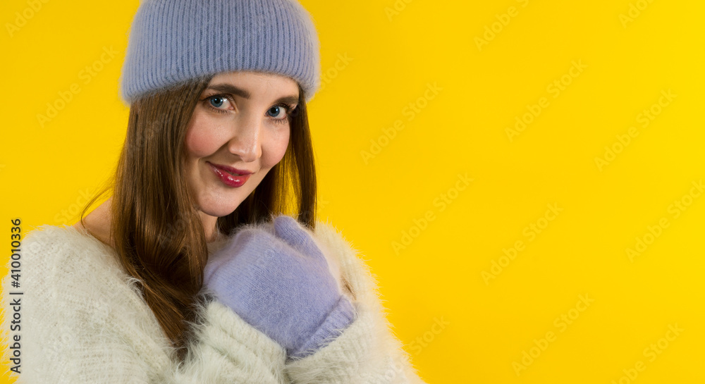 Emotional girl in winter hat, gloves and expressing happiness Emotional girl in winter hat, gloves and expressing happiness