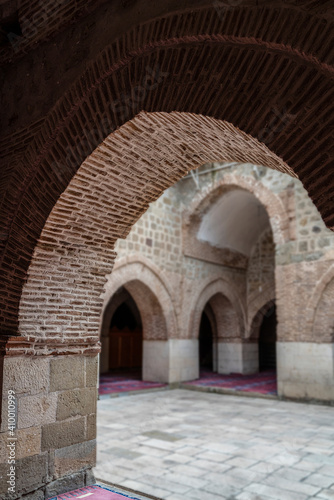 Elazig, Turkey-September 18 2020: Arch-shaped door and the following arches in Great Mosque (Ulu Camii) in Harput Town