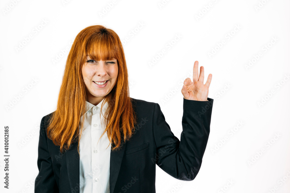 Closeup shot of a businesswoman expressing success on an isolated background - success concept Closeup shot of a businesswoman expressing success on an isolated background - success concept