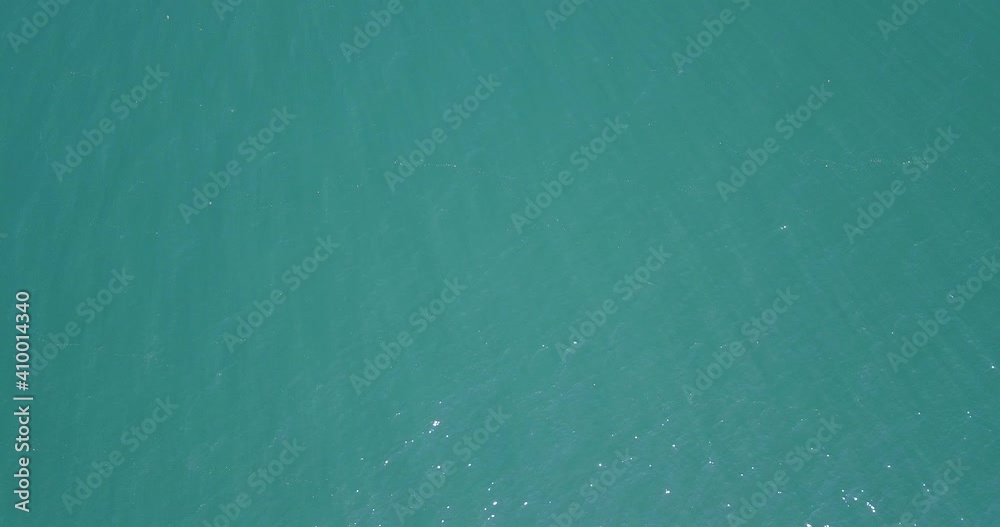 Top View Slow motion looping c ripples and wave, Refraction of sunlight top view texture sea side, Foaming and Splashing in the Ocean, Sunny Day, Slow Motion Video. Veiw from drone Top View Slow motion looping c ripples and wave, Refraction of sunlight top view texture sea side, Foaming and Splashing in the Ocean, Sunny Day, Slow Motion Video. Veiw from drone