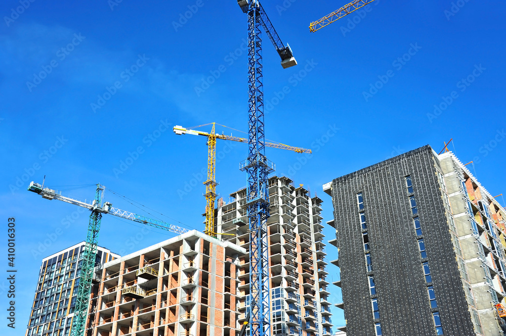 Crane and highrise construction site Crane and highrise construction site