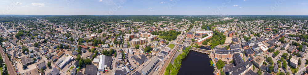 Historic Francis Cabot Lowell Mill building at Charles River and Waltham historic city center aerial view in city of Waltham, Massachusetts MA, USA. 