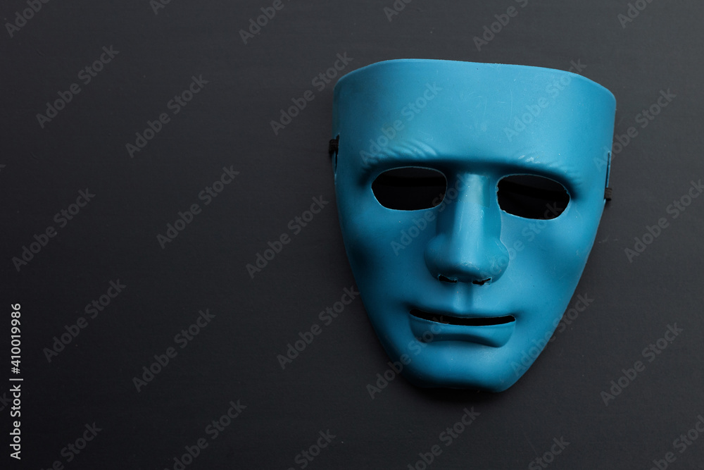 Blue face mask on dark background. Blue face mask on dark background.