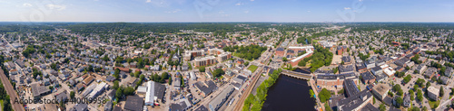 Fototapeta Naklejka Na Ścianę i Meble -  Historic Francis Cabot Lowell Mill building at Charles River and Waltham historic city center aerial view in city of Waltham, Massachusetts MA, USA. 
